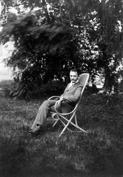 The Painter Félix Vallotton Sitting in the Garden of the Relais, the Natansons